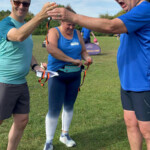 Mike presents Darren with his completion medal